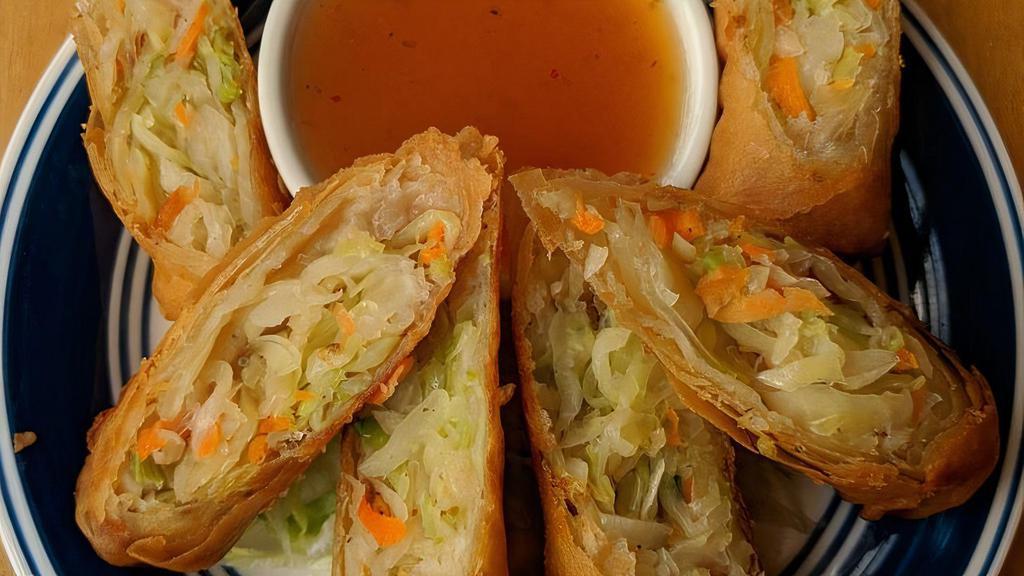 Spring Roll · Golden fried rolls filled with clear noodles, carrots, celery and cabbage served with plum sauce.