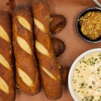 6 Soft Pretzels · 6 Soft Pretzel Breadsticks served with Beer Cheese Queso and Local Mustard