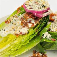 Bt Wedge · Crisp Romaine Hearts Drizzled in Blue Cheese Dressing, Blue Cheese Crumbles, Marinated Tomat...