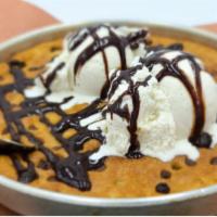 Skillet Cookie · Chocolate Chip Cookie Big Enough to Share.  Served with Ice Cream on the Side.
