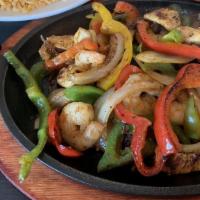 Fajita Catrina · Sizzling skillet of bell peppers and onions with our combination of steak, chicken and shrimp.