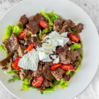 Gyro Salad · Our famous Greek salad topped with delectable gyro meat.