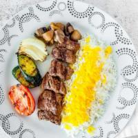 Shish Kabob · A skewer of our specially seasoned and marinated filet mignon. Served with grilled vegetable...