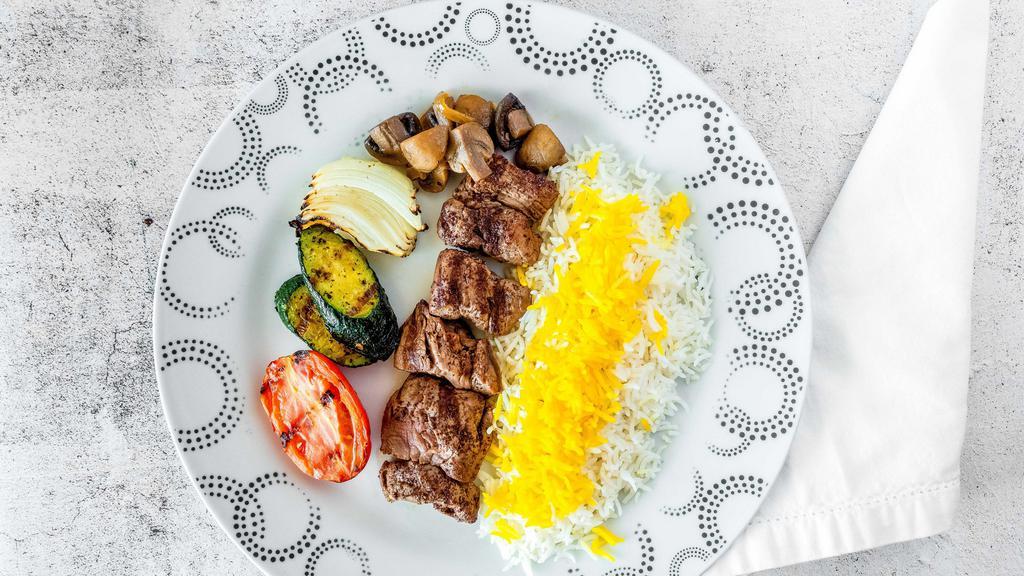 Shish Kabob · A skewer of our specially seasoned and marinated filet mignon. Served with grilled vegetables on a plate of Saffron Rice.