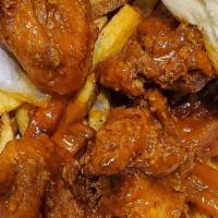 Wings · Served with fries. Perfectly chicken wings served with fries and your choice of sauce.