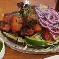 Bawarchi Tandoori Mix Grill · Bawarchi special. Combination of tandoori chicken, malai kebab, chicken tikka kebab and Tand...