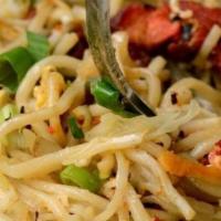 Vegetable Hakka Noodles · Noodles stir-fried with veggies and spices.