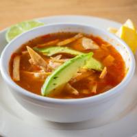 Tortilla Soup · Made with chicken, corn, black beans, cheese, avocado, and tortilla strips.