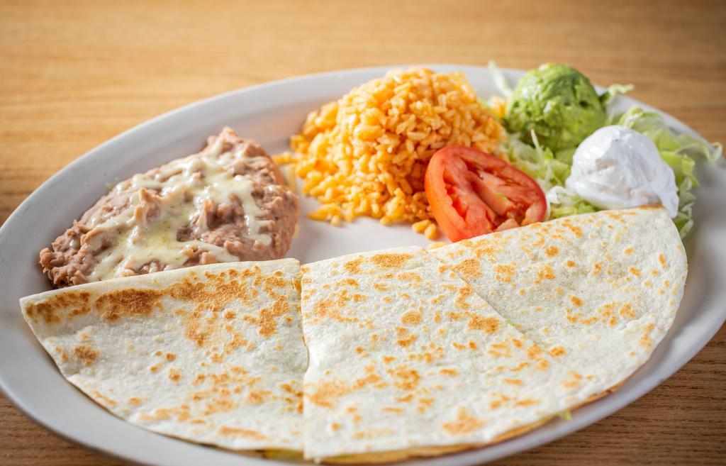 Quesadilla Supreme Dinner · Choose from chicken, ground beef, shredded beef, al pastor, chorizo or veggie, cheese, sour cream, and guacamole inside.