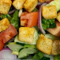 Garden Salad · A blend of fresh cut romaine and iceberg lettuce, croutons, cucumbers, tomatoes, and red oni...
