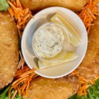 Basket Of Fish & Chips · Four pieces of breaded cod served with tartar sauce.