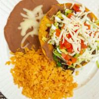 Tostadas · Flat shell tortilla served with your choice of meat beans lettuce tomatoes cheese and sour c...