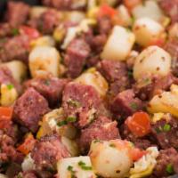 Corned Beef Hash · Salt cured beef potatoes and onions.