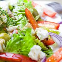 Greek Salad · Lettuce, tomatoes, olives, beets, onions, banana peppers, and feta cheese. Greek Dressing. A...