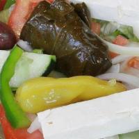 Greek Salad · Romaine and iceberg lettuce, tomatoes, cucumbers, green peppers, onions, olives, feta, peppe...