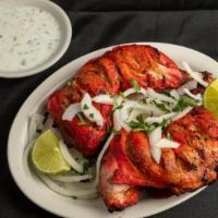 Chicken Tikka · Salad with marinated and spiced chicken. Marinated and spiced chicken.