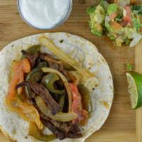 Grilled Chicken Fajita · Fajitas are grilled with bell peppers, onions and tomatoes.