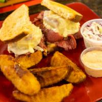 Corned Beef · 6 oz. hot thin sliced Sy Ginsberg corned beef and Swiss cheese, topped with Russian dressing...
