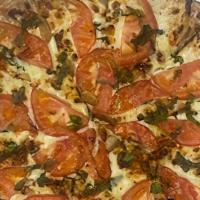 The Margherita · Thin crust pizza with your choice of pizza sauce or olive oil glaze topped with fresh basil,...