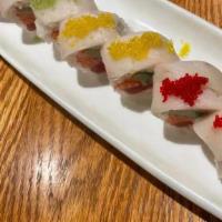 Perfect Roll · Salmon, tuna, yellowtail, and avocado wrapped in soybean paper. Topped with white tuna and r...
