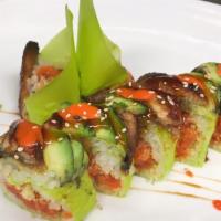 Outstanding Roll · Spicy tuna and tempura crunch inside. Topped with eel, avocado, spicy mayo, and eel sauce.