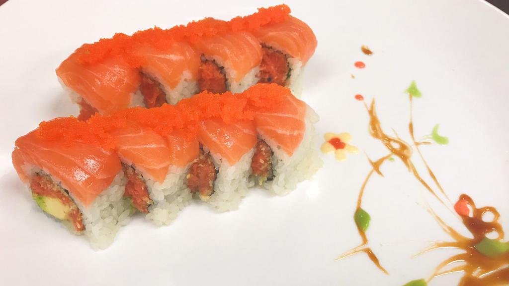 Sunshine Roll · Spicy tuna and avocado inside. Topped with salmon and masago.