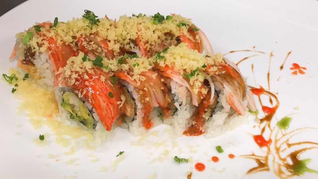 Shaki Maki Roll · Tempura salmon and avocado topped with crunch, crabmeat, scallions, masago, spicy mayo, and eel sauce.