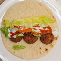 Falafel Sandwich · Delicious falafel inside pita bread with tomatoes & lettuce with our specially made hot and ...