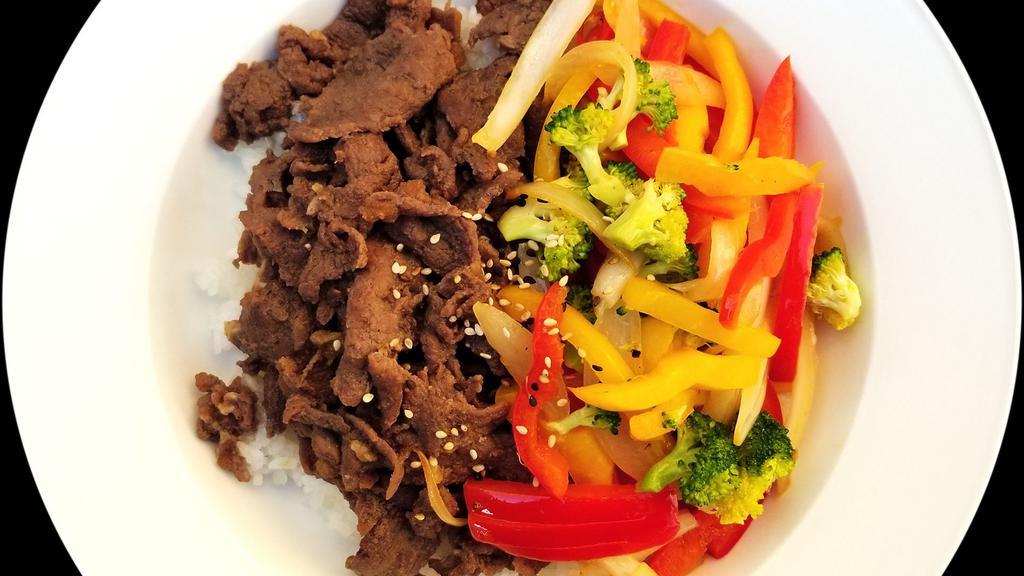 Beef Rice Bowl · Stir-Fried & Marinated Beef Bulgogi Served over rice and stir-fried vegetables. Contains red pepper, yellow pepper, onions, and broccoli. Sriracha sauce on the side