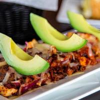Alambre · Grilled chicken, grilled steak, Mexican sausage and onions all topped with melted Monterrey ...