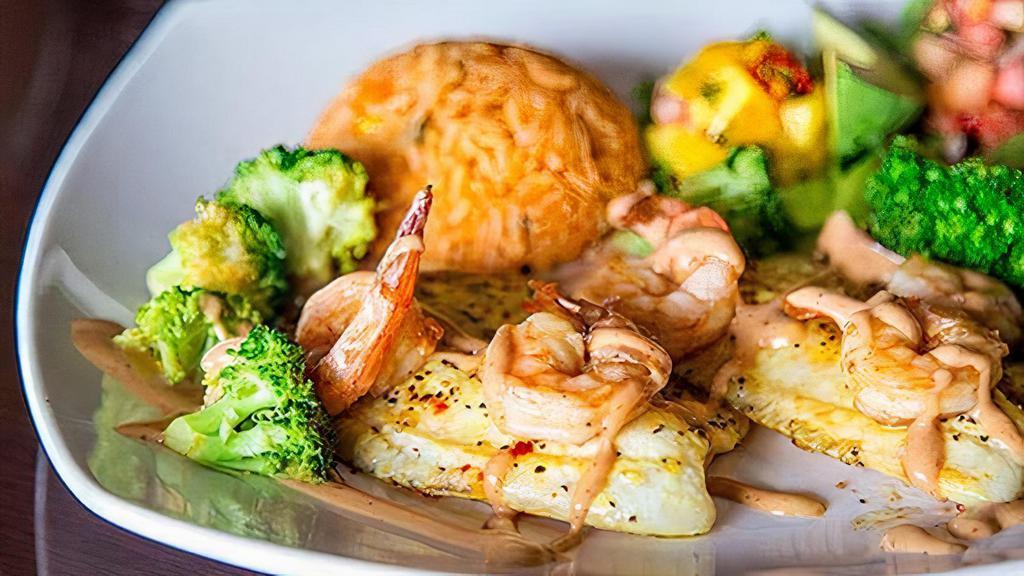 Tilapia And Shrimp · A perfect combination of fillet of fish and shrimp seasoned with our special seafood sauce. Sided with rice, avocado, fresh orange slices, broccoli and tortillas.