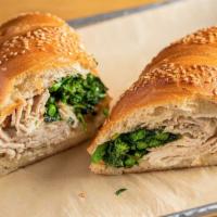 Pork And Greens · shaved roast pork loin, grilled rapini, provolone cheese, Calabrian chili aioli, sesame seed...