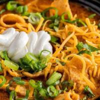 Jt'S Chili Quart - Loaded Up W/ Toppings · Quart of JT's Chili loaded with a bag of Fritos, shredded cheddar, fresh cilantro, serrano p...