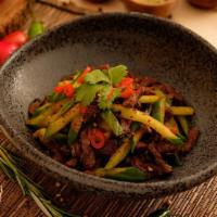 Jibek Jolu · Pan seared tender steak slices with cucumbers, onions, bell peppers, tomatoes, cilantro
garl...