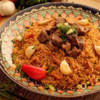 Plov · Legendary national rice dish cooked in a traditional cast-iron kazan. Rice in a seasoned bro...