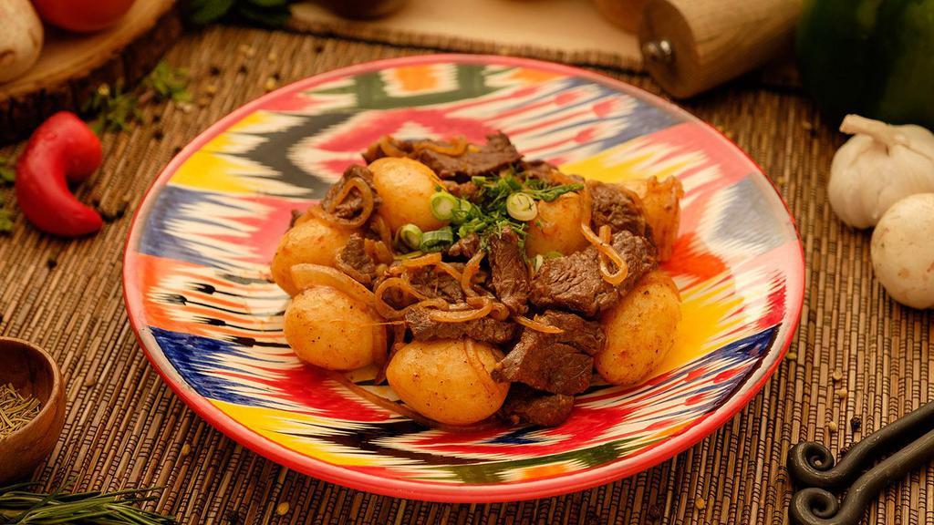 Kuurdak · Ancient Kyrgyz dish. Perfectly seasoned sauteed meat of your choice, with onions and roasted baby
potatoes.