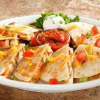 Chicken Quesadilla Family Pack Meal · Grilled tortillas, chicken breast, onions, tomatoes, cheddar and jack cheeses. Sour cream an...
