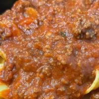 Papardelle Bolognese · Homemade wide fettucini, beef/veal meat sauce