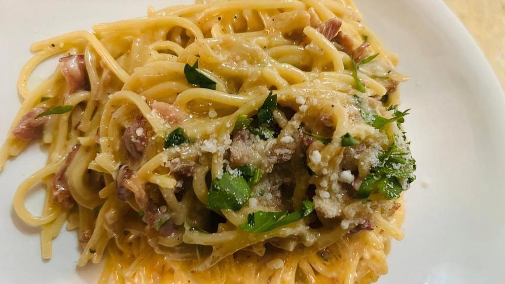 Spaghetti Carbonara · Pancetta, onions, Pecorino Romano, eggs