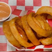 Beer Battered Onion Rings · Perfectly golden brown and creamy BBQ.