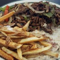 Shawarma · Chicken or beef slowly roasted and thinly sliced.