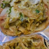 Chilaquiles · crispy tortilla strips, onion, cilantro, crema & queso fresco, beans, salsa verde.