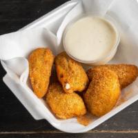 5 Pc Jalapeno Poppers · Breaded and fried jalapeños filled with cream cheese.