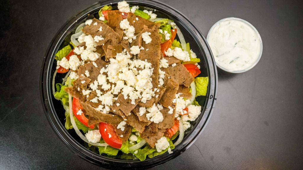 Gyro Salad · Gyro meat, feta cheese, tomatoes and onions with homemade tzatziki sauce on the side.