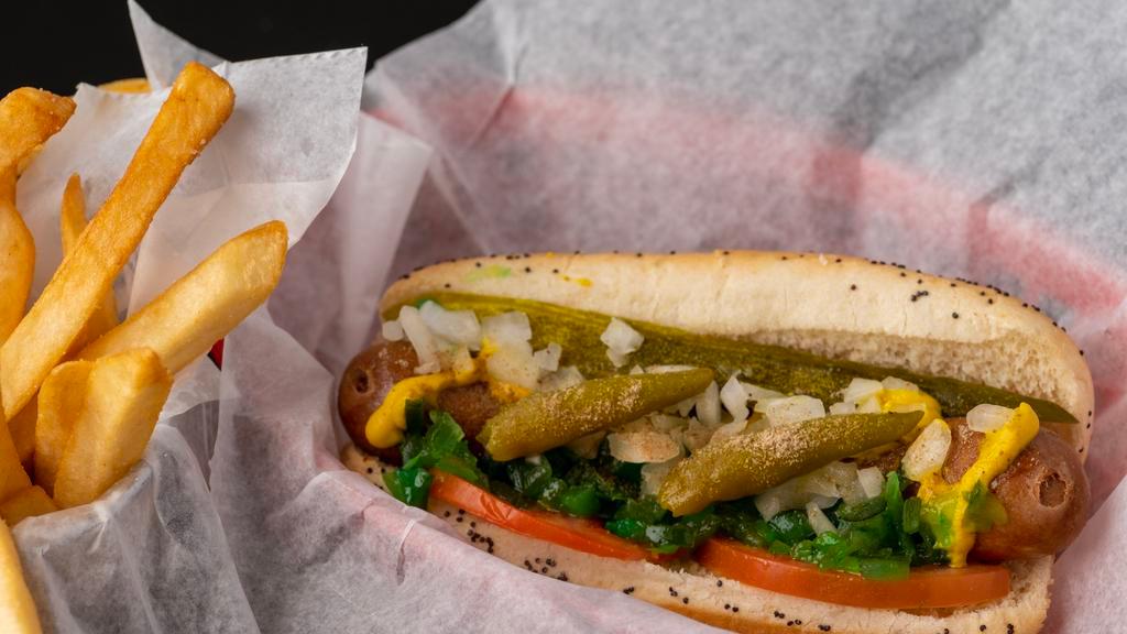Chicago Style Dog · Hot Dog on a poppy seed bun with pickle, tomato, mustard, relish, onions, sport peppers & celery salt.