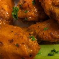 Pub Chicken Wings (14 Count) · Bone-in or boneless: Sriracha BBQ, mango habanero, buffalo or Guinness BBQ; bleu cheese or r...