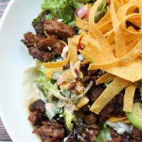 Carne Asada Steak Salad · Mixed greens, avocado, tomato, corn, beans, cilantro, onion, queso fresco, tortilla strips, ...