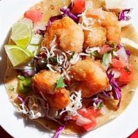 Baja Shrimp Taco · BATTERED SHRIMP, PURPLE CABBAGE, PICO, FRESCO CHEESE, BAJA SUCE, CORN TORTILLA