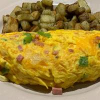 Denver Omelette · Smoked ham, house-roasted onions, green peppers and melted Jack and cheddar cheese.