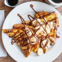 Nutella French Toast · Two pieces of brioche bread dipped in our house-made batter and griddled golden brown. Then ...